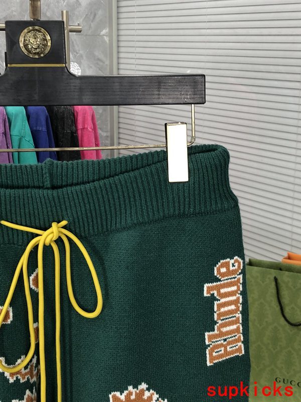 Flat lay presentation of Rhude luxury clothing with contemporary cut