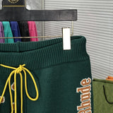 Flat lay presentation of Rhude luxury clothing with contemporary cut