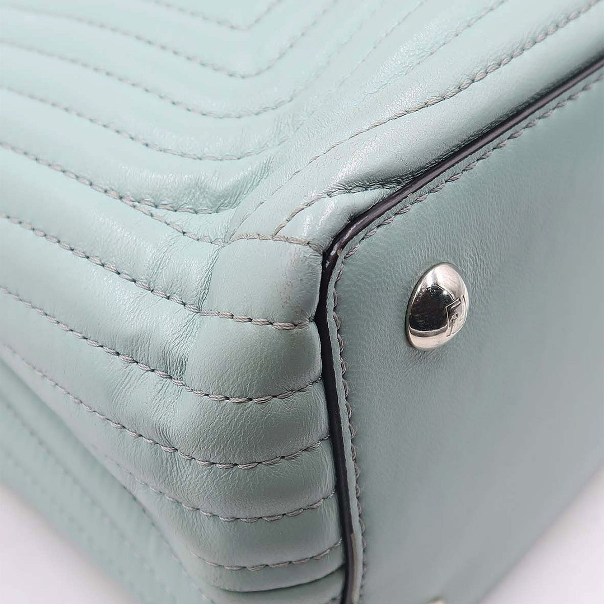 Close-up of DotCom bags hardware and fine stitching