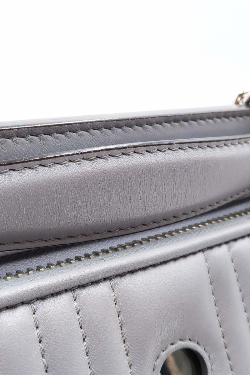 Close-up of DotCom bags hardware and fine stitching