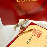 Side view of Cartier unisex jewelry piece