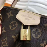Handle and strap detail of polished refined women's handbag – women's statement bag