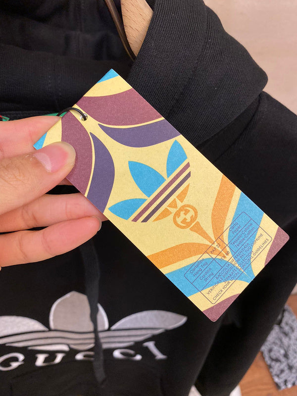 Close-up detail shot of Gucci luxury clothing with label-forward styling