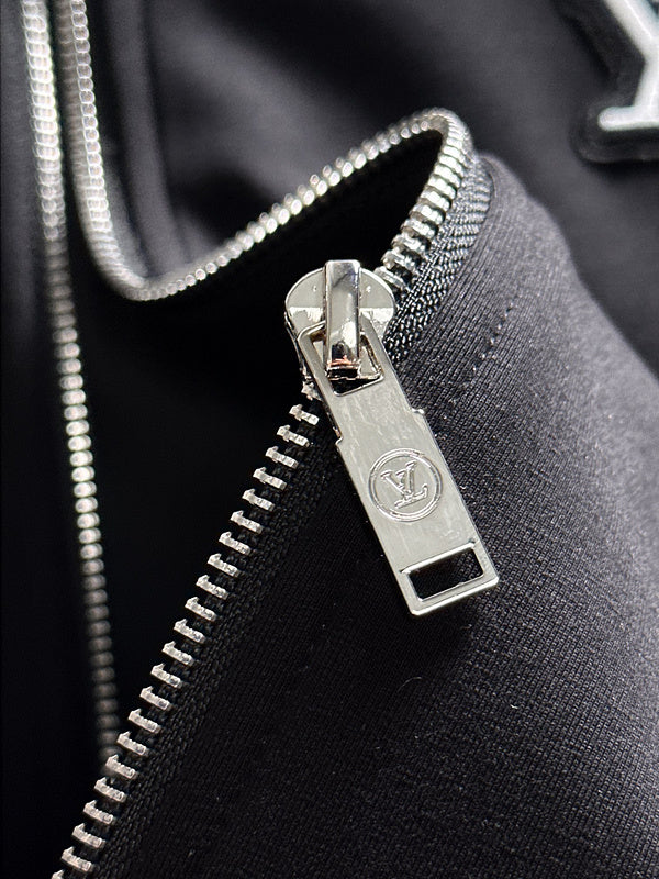 Flat lay presentation of Louis Vuitton luxury clothing with runway-inspired design