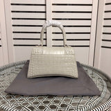 Close-up detail of modern polished women's handbag – women's designer-style accessory