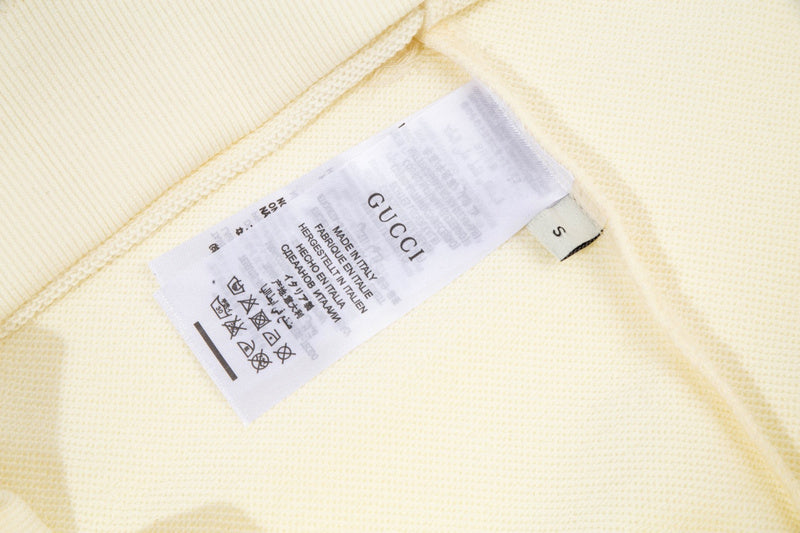 Close-up detail shot of Gucci luxury clothing with relaxed-fit cut