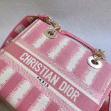 Side profile of polished classic women's handbag – women's luxury accessory