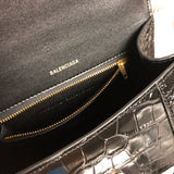 Side profile of classic sleek women's handbag – women's luxury accessory