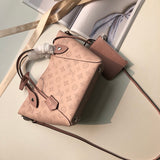 Top view of elevated signature women's handbag – women's statement bag