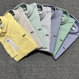 Close-up detail shot of Lacoste luxury clothing with monogram-inspired silhouette