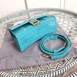 Back view of structured polished women's handbag – women's luxury accessory