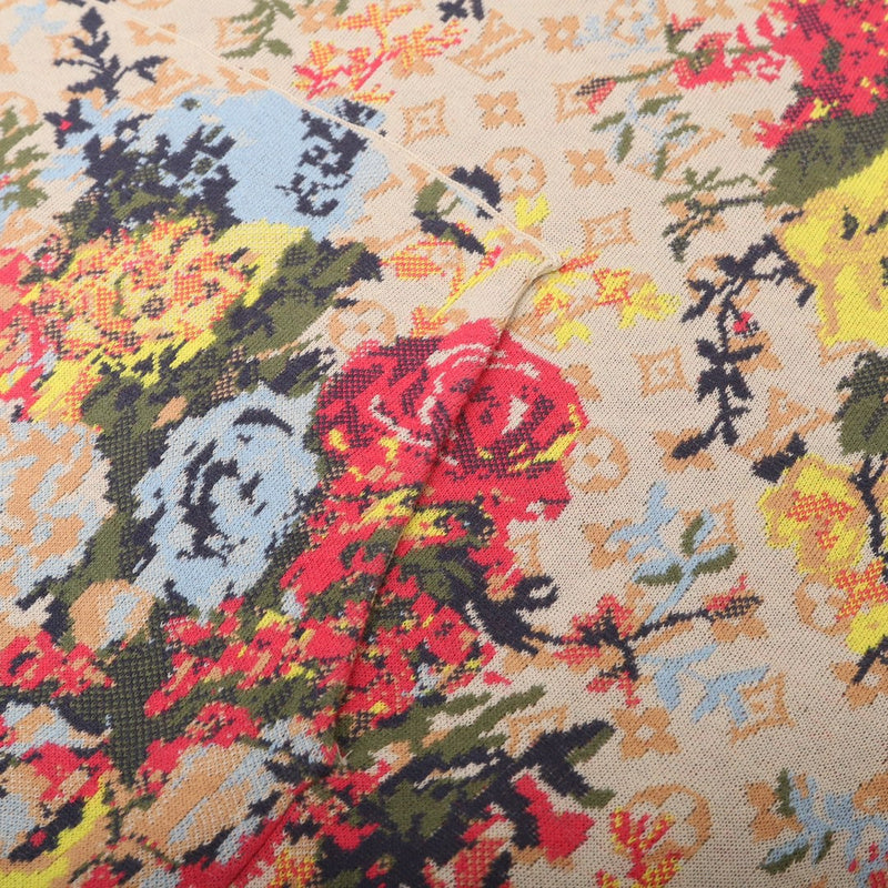 Close-up detail shot of Louis Vuitton luxury clothing with label-forward styling