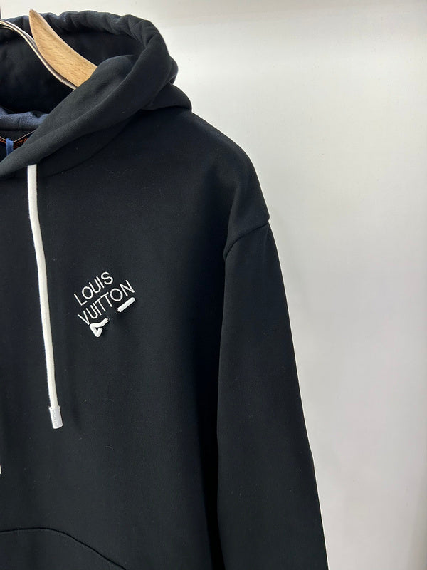 Flat lay presentation of Louis Vuitton luxury clothing with relaxed-fit cut