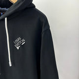 Flat lay presentation of Louis Vuitton luxury clothing with relaxed-fit cut