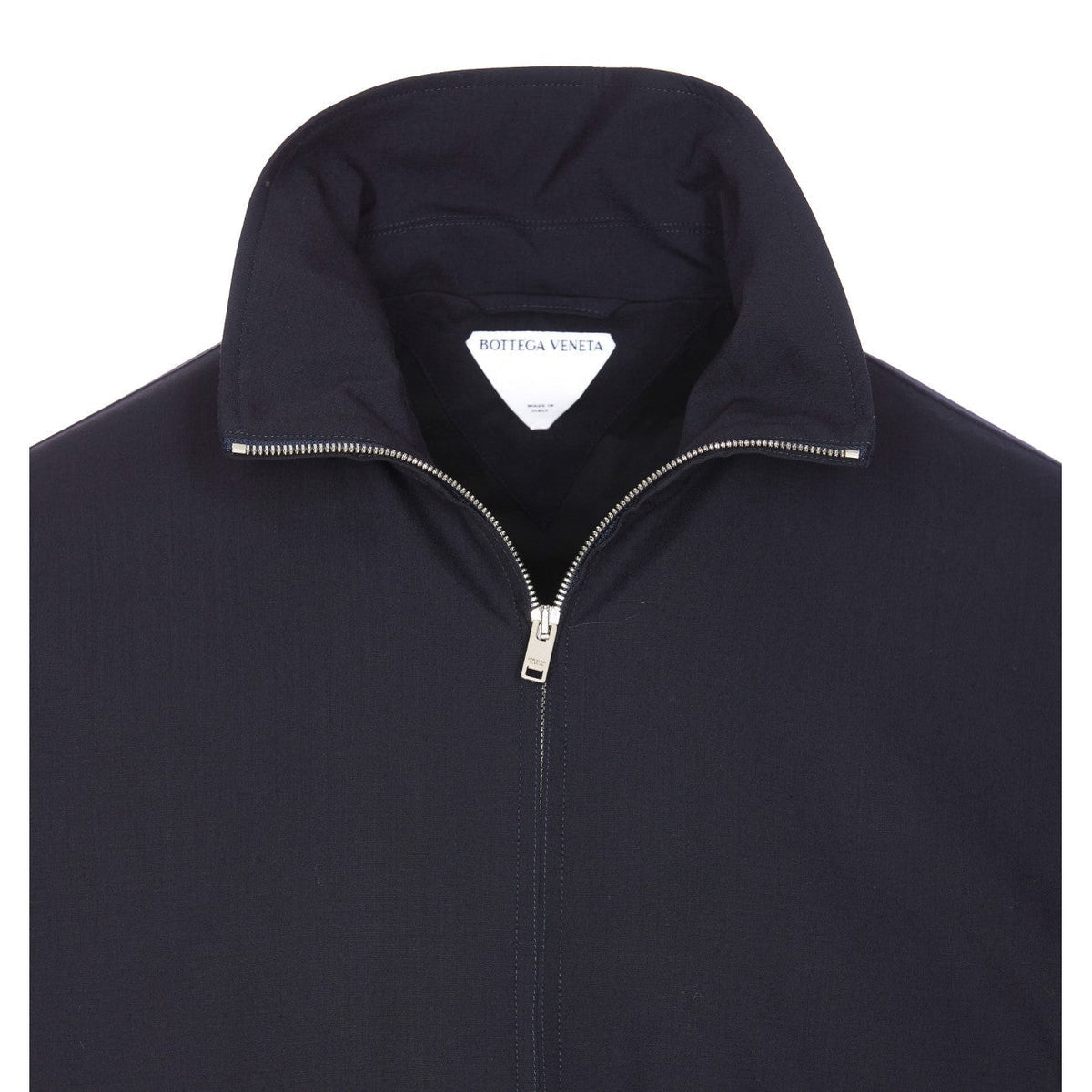 Close-up of Bottega Veneta jackets hardware and fine stitching