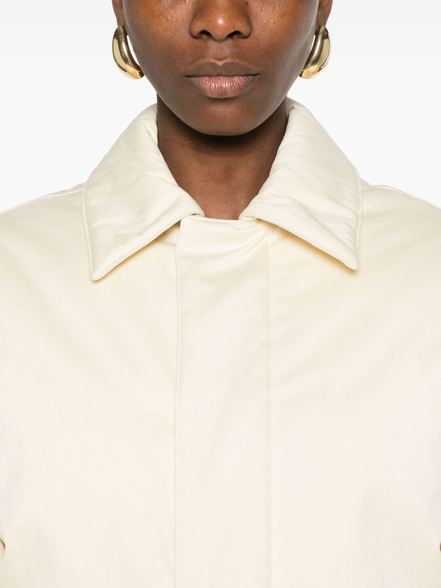 Close-up of Bottega Veneta coats hardware and fine stitching