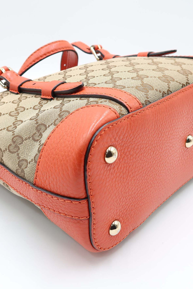Close-up of Belted bags hardware and fine stitching
