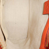 Close-up of Belted bags hardware and fine stitching
