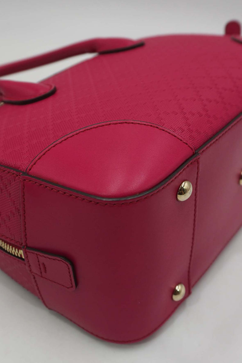 Close-up of Bright bags hardware and fine stitching