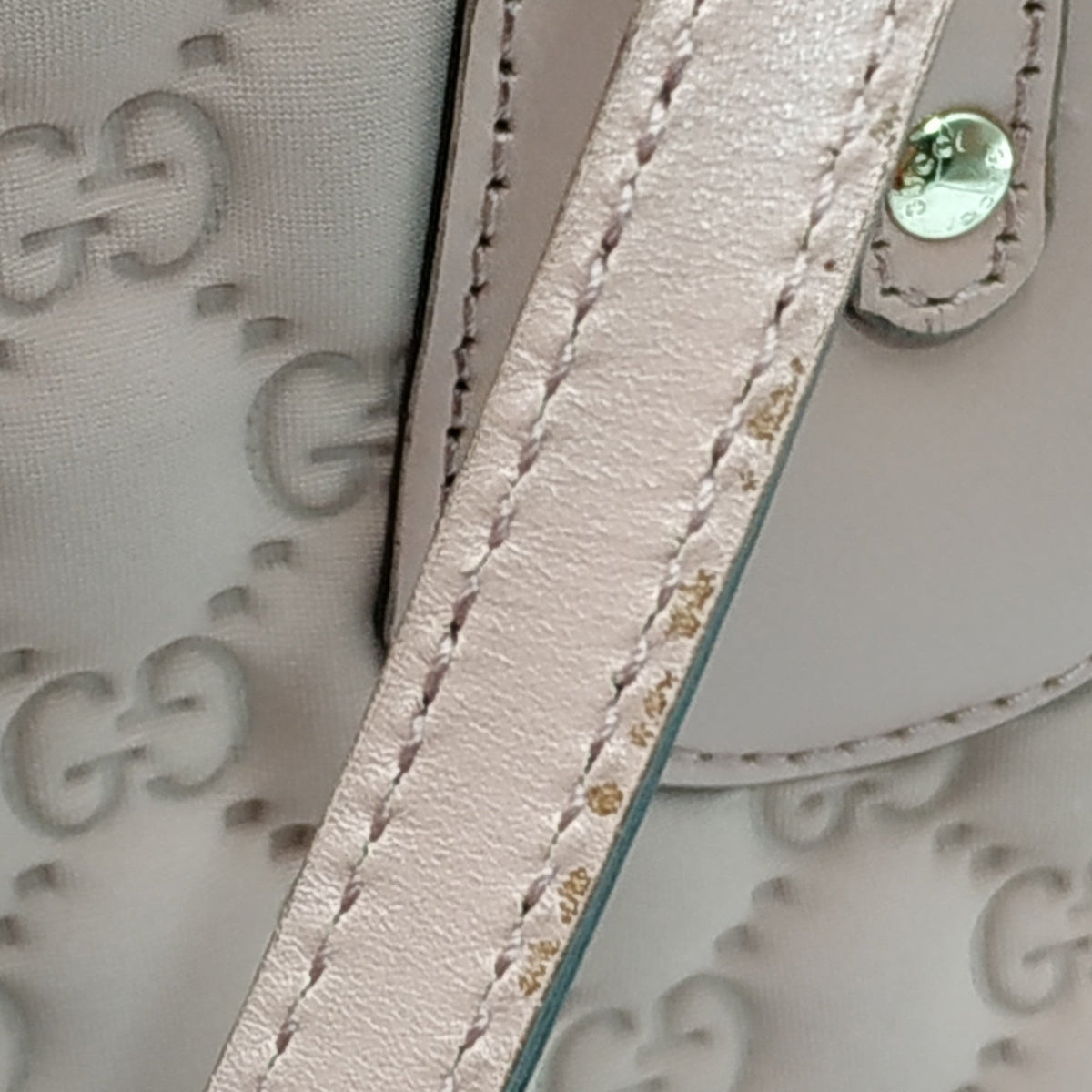 Close-up of Heart bags hardware and fine stitching
