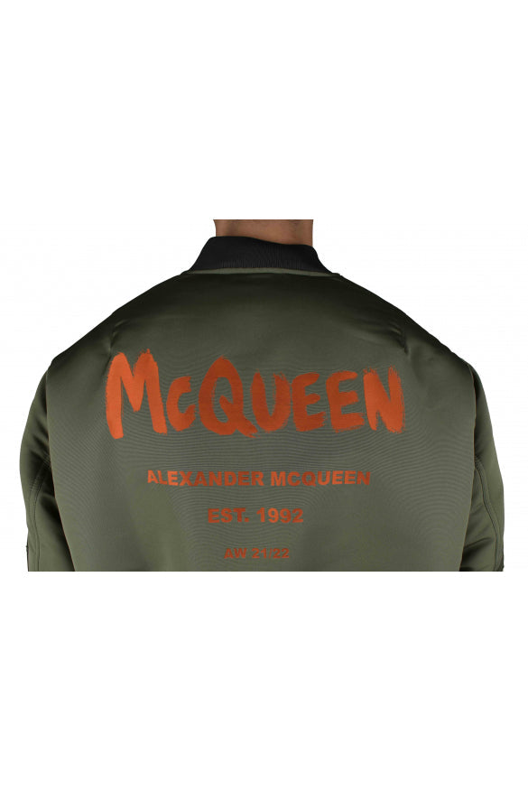 Close-up of Alexander McQueen jackets hardware and fine stitching