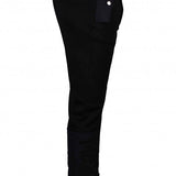 Close-up of Alexander McQueen pants hardware and fine stitching