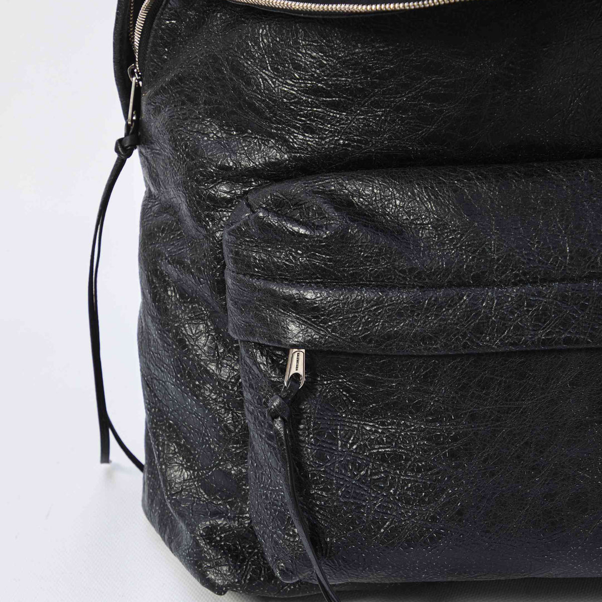 Close-up of Balenciaga backpacks hardware and fine stitching