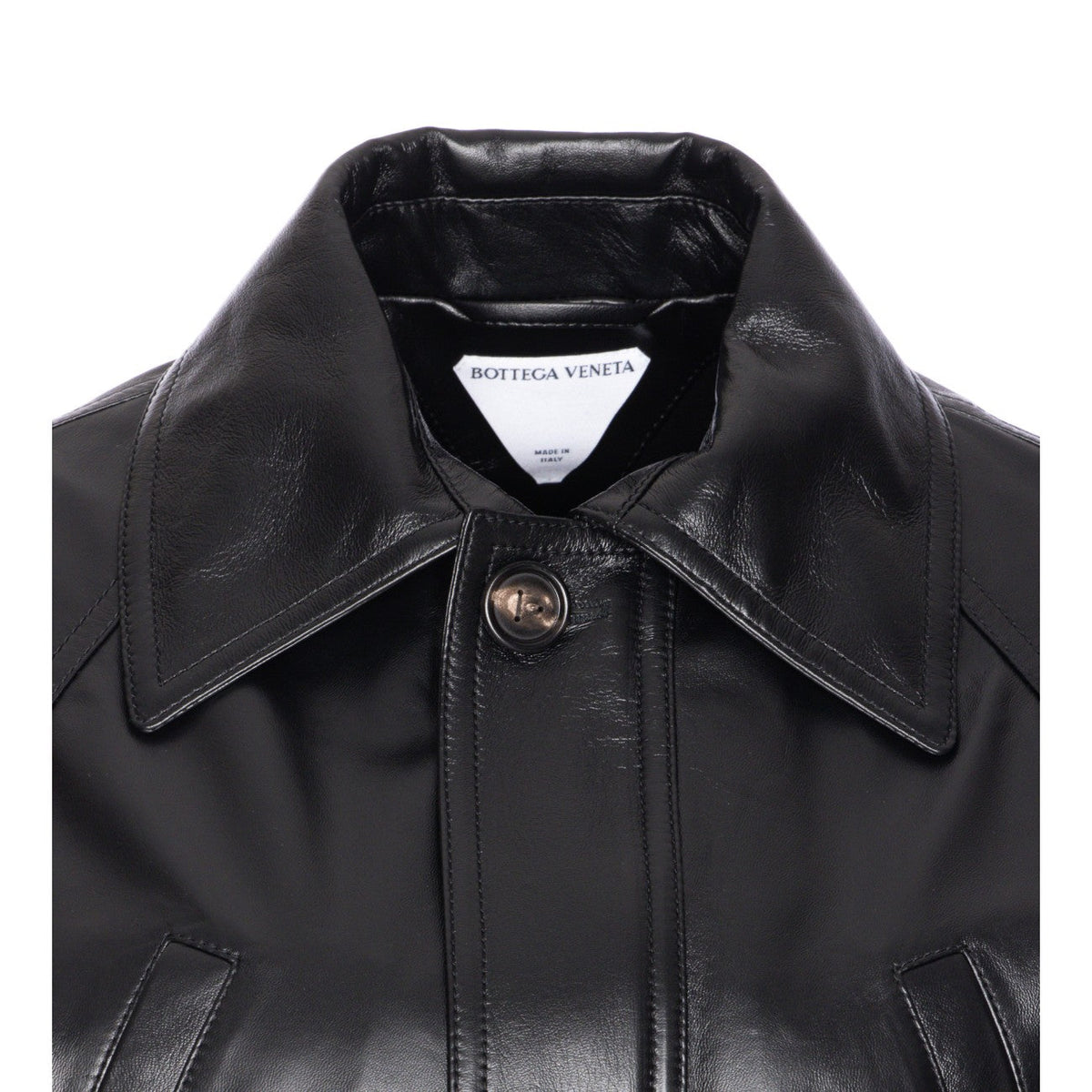 Close-up of Bottega Veneta coats hardware and fine stitching