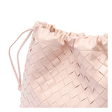 Close-up of Bottega Veneta clutches hardware and fine stitching