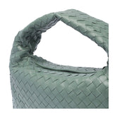 Close-up of Bottega Veneta totes hardware and fine stitching