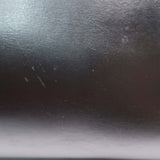 Close-up of Cassandre bags hardware and fine stitching