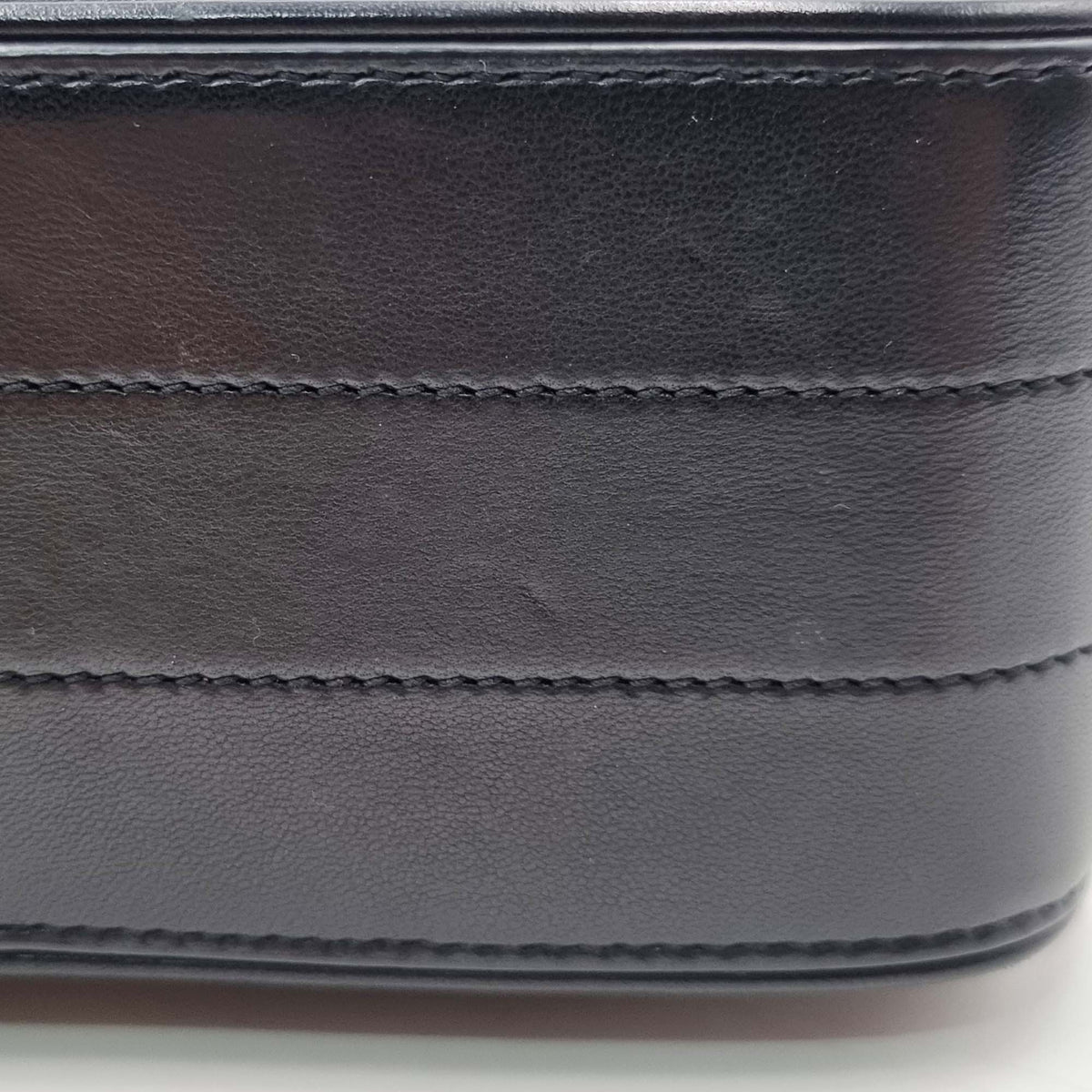 Close-up of Medium bags hardware and fine stitching
