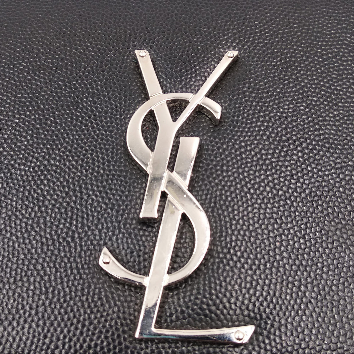 Monogram premium bags detail and craftsmanship close-up