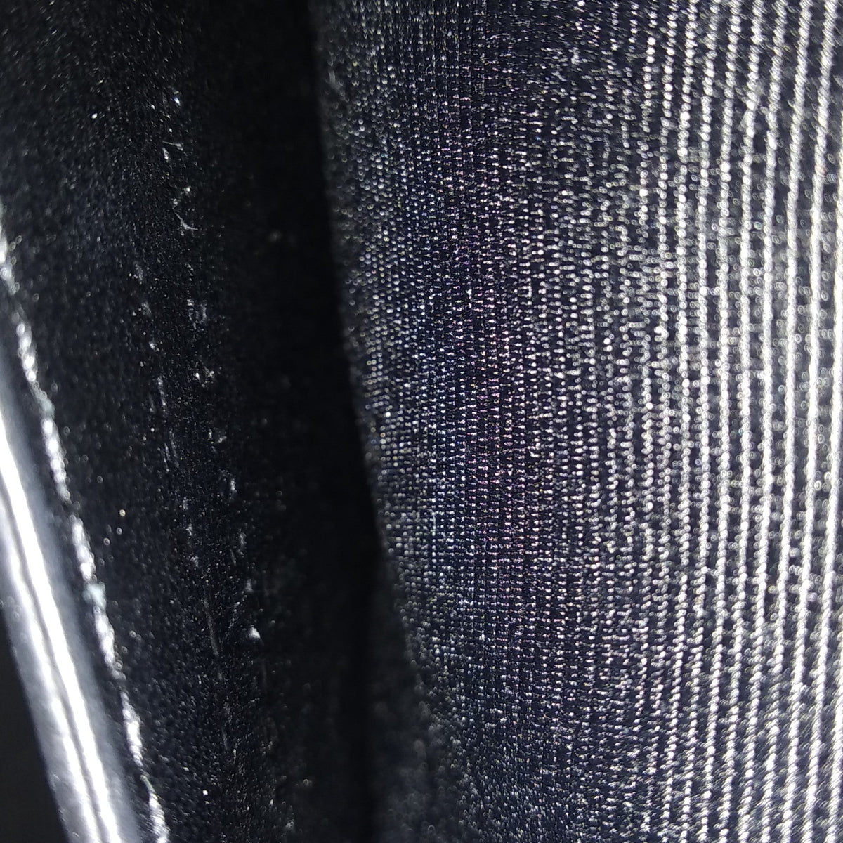 Close-up of Monogram bags hardware and fine stitching