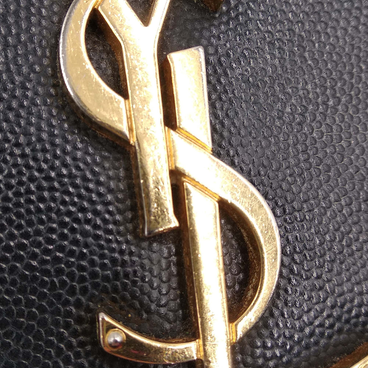 Close-up of Monogram bags hardware and fine stitching