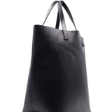 Close-up of Perforated bags hardware and fine stitching