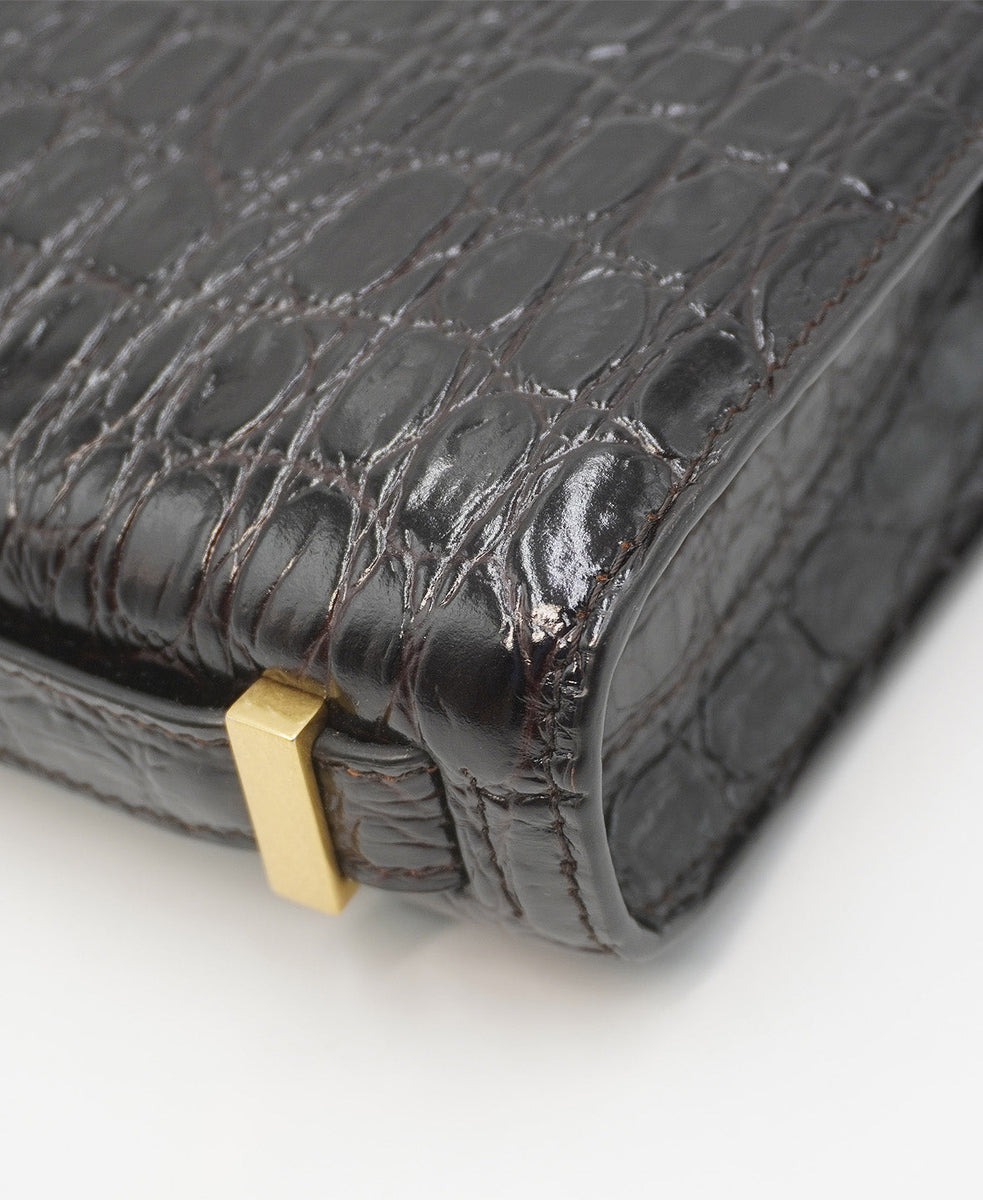 Close-up of Croco bags hardware and fine stitching