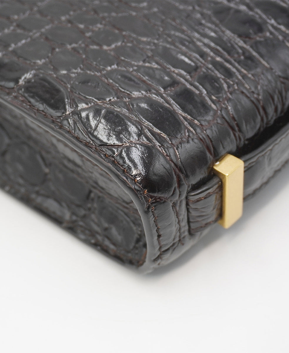 Close-up of Croco bags hardware and fine stitching