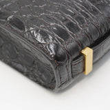 Close-up of Croco bags hardware and fine stitching