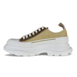 Close-up of Alexander McQueen athletic hardware and fine stitching