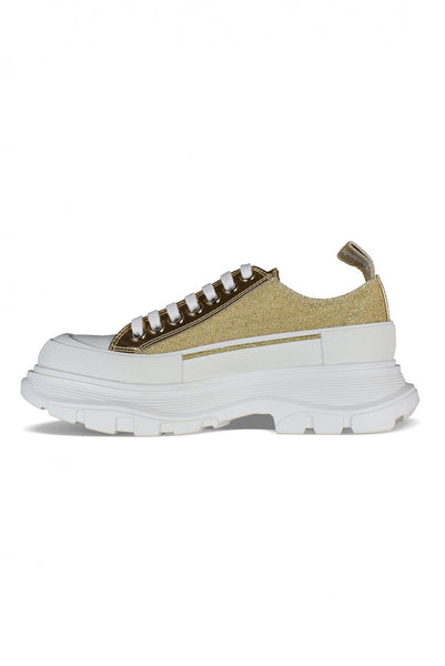 Close-up of Alexander McQueen athletic hardware and fine stitching
