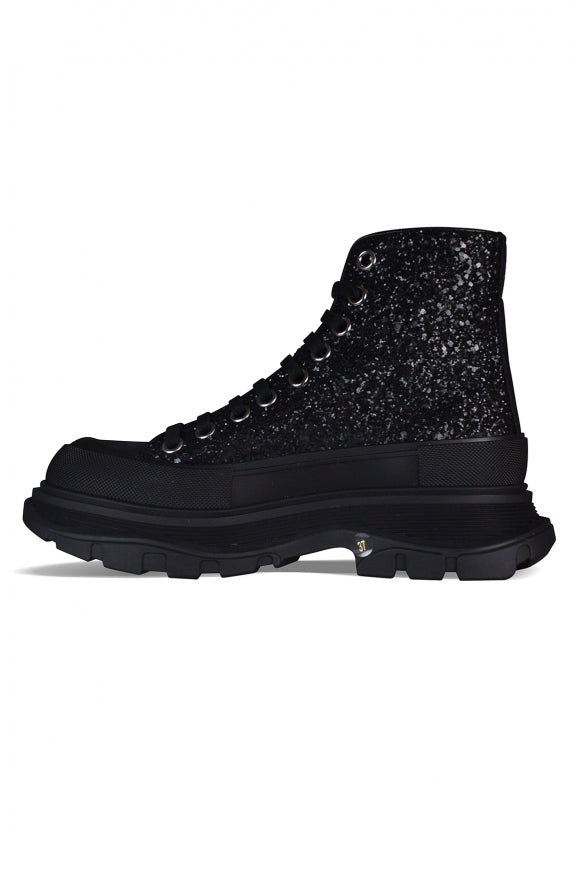 Close-up of Alexander McQueen athletic hardware and fine stitching