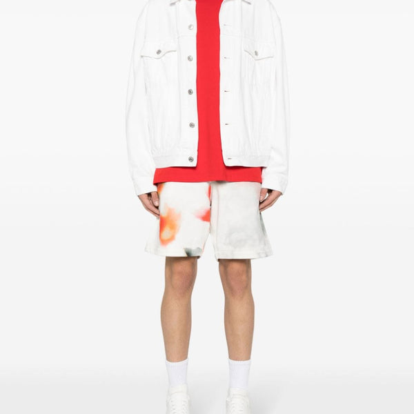 Close-up of Alexander McQueen pants hardware and fine stitching