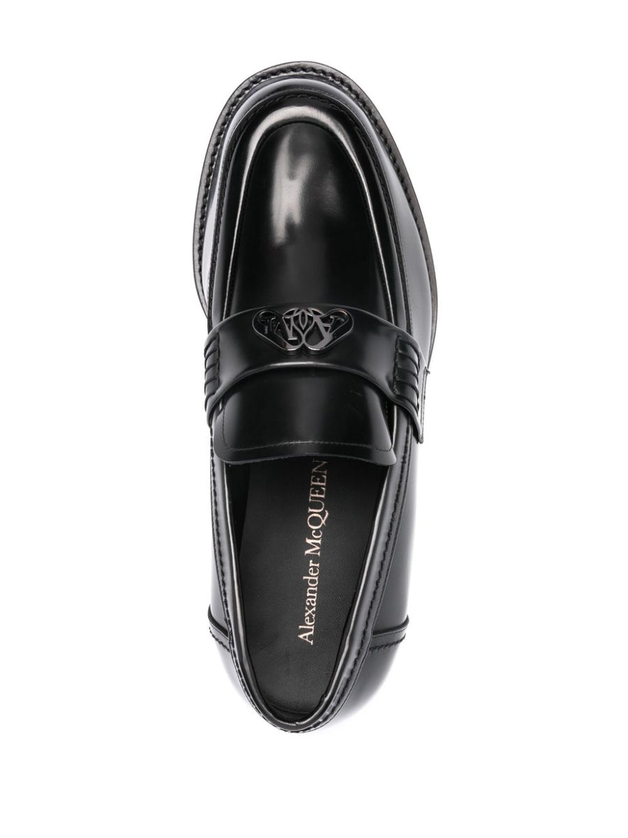 Close-up of Alexander McQueen slides hardware and fine stitching
