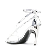 Close-up of Alexander McQueen sandals hardware and fine stitching
