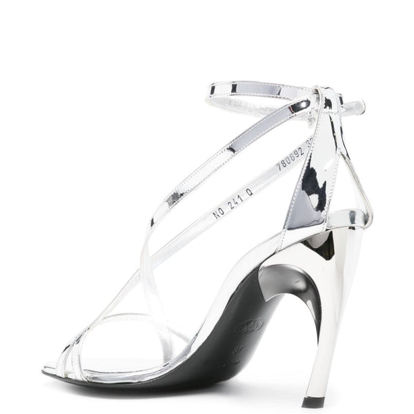 Close-up of Alexander McQueen sandals hardware and fine stitching