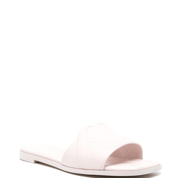 Close-up of Alexander McQueen sandals hardware and fine stitching