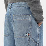 Close-up of Bottega Veneta pants hardware and fine stitching