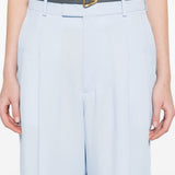 Close-up of Bottega Veneta pants hardware and fine stitching