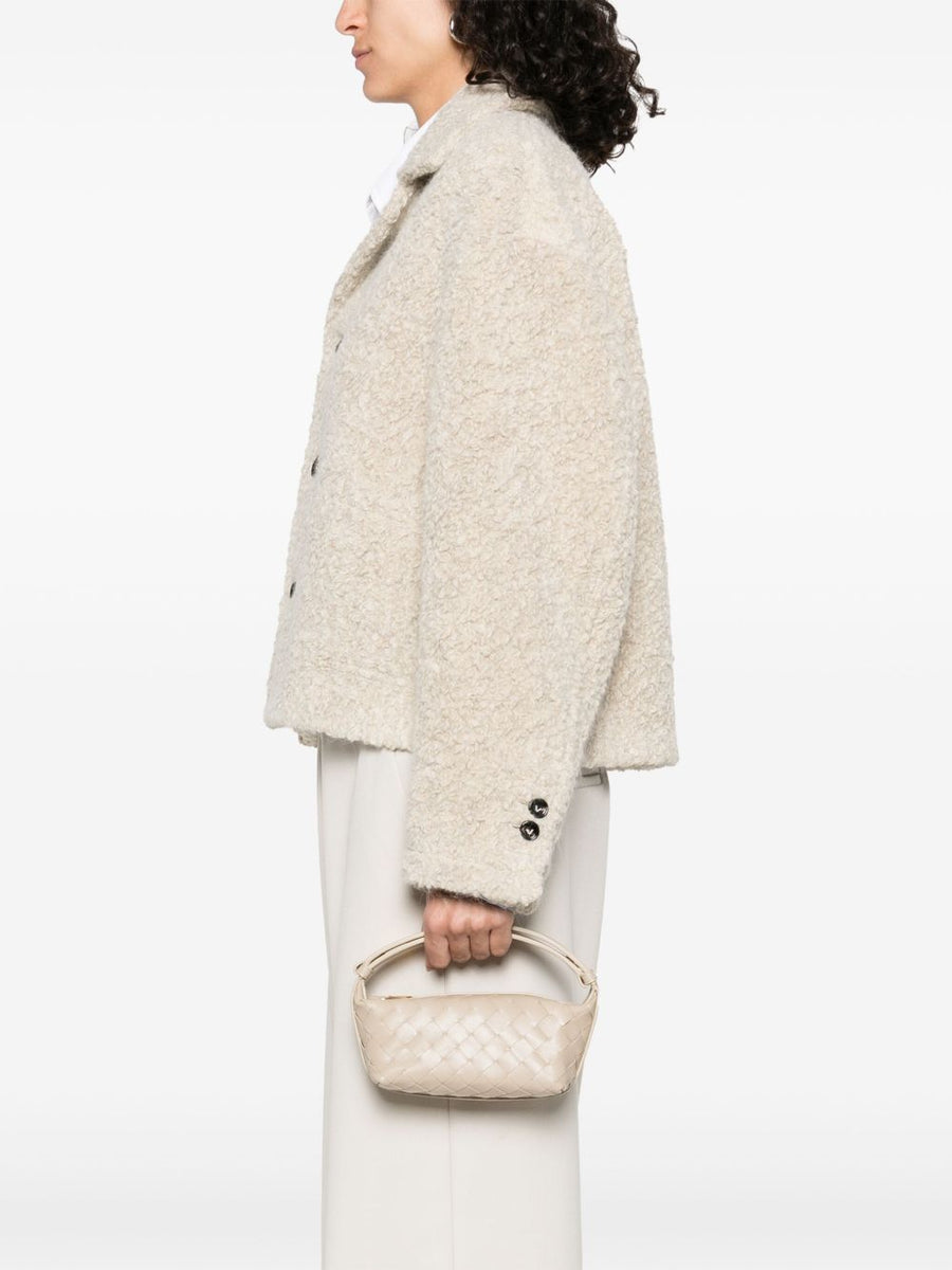 Close-up of Bottega Veneta women woman--mini bags-- hardware and fine stitching